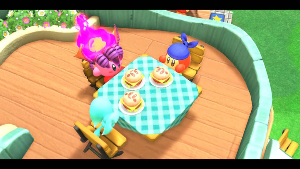 Kirby, Elfilin und der Waddle Dee Helfer essen zusammen.